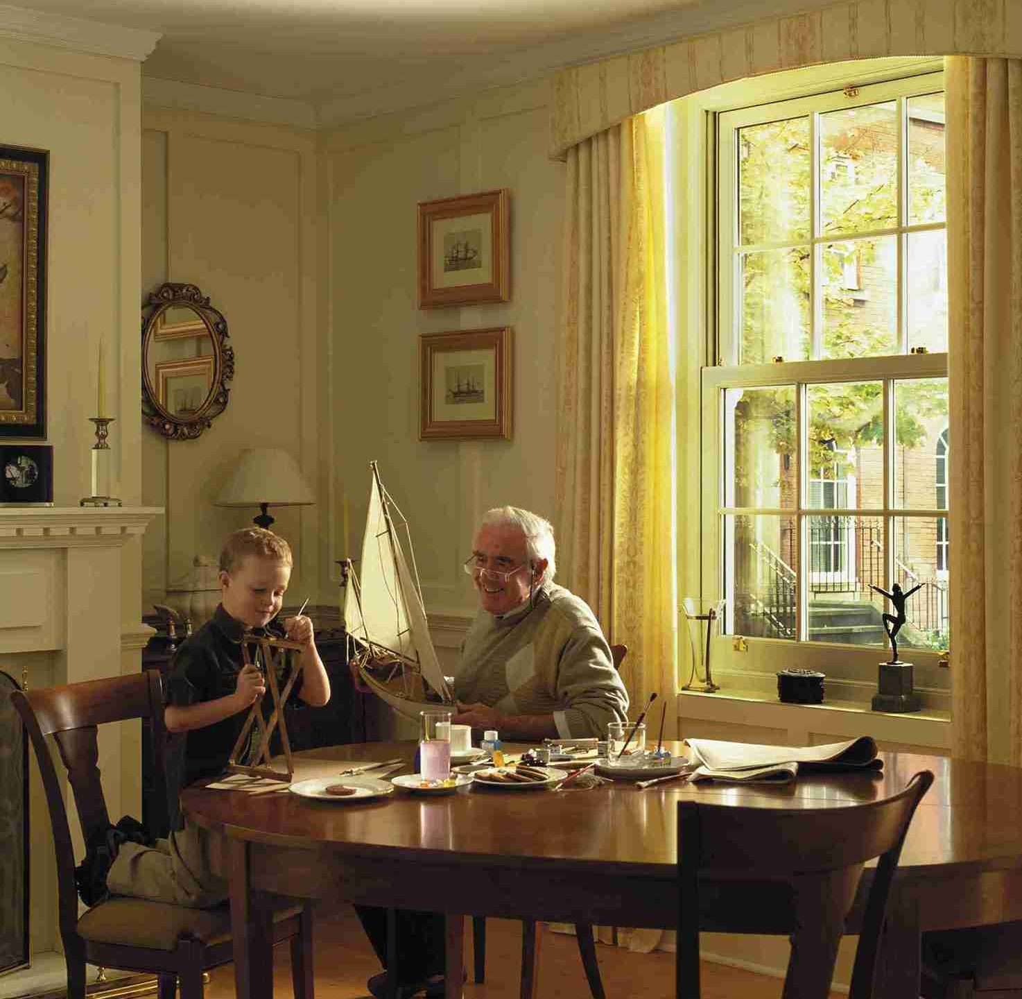 family in their home with Georgian sash windows