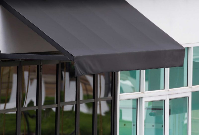 white and black Aluminium Casement Windows on commercial shopfront