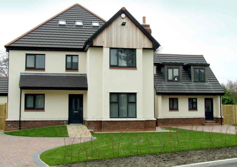 House with casement windows and small front garden