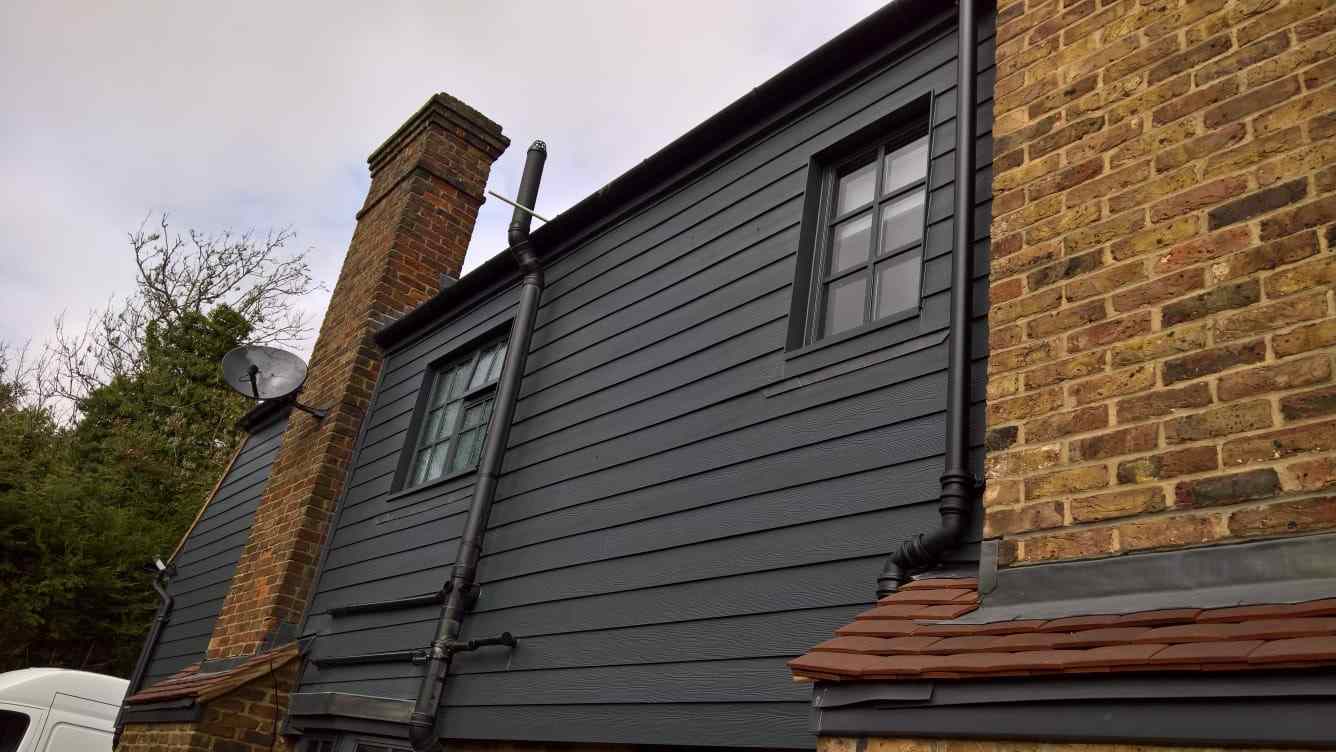 black wooden home with black aluminium heritage windows Portsmouth