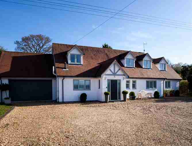 grey uPVC windows on mock Tudor home